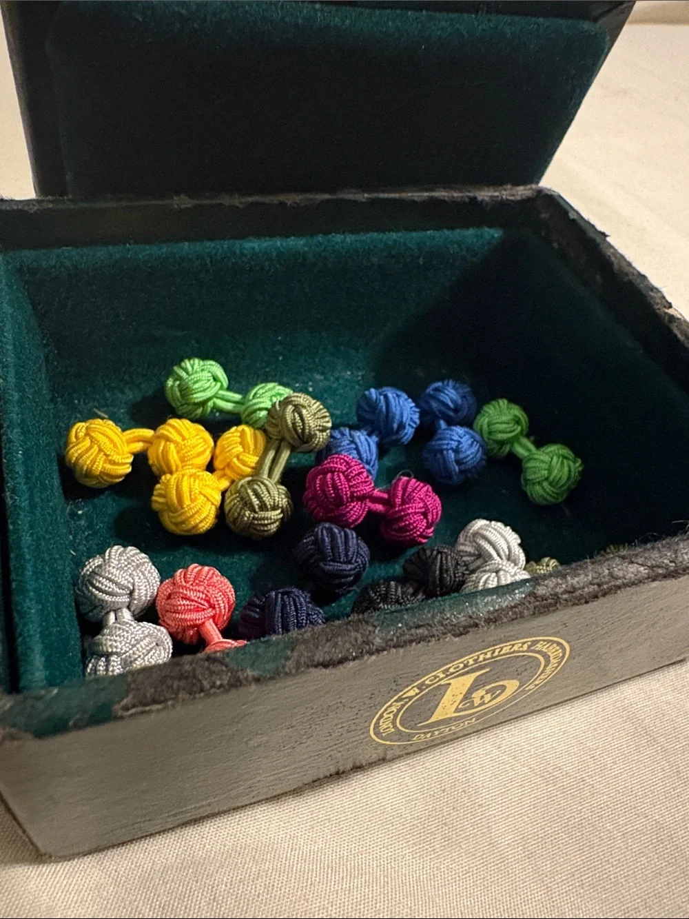 London W. Clothiers & Haberdashers vintage box & several silk knot cuff links